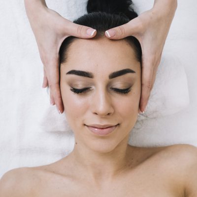 woman-receiving-relaxing-facial-massage